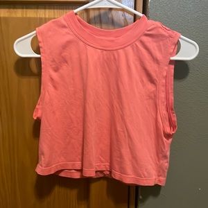 peach lululemon flowy cropped top.